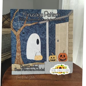 May include: A Kinusaiga pattern craft project featuring a white ghost holding an orange pumpkin, a dark blue starry night background, a brown tree with a spider web, a beige door, and two jack-o'-lanterns. Text reads Kinusaiga Pattern, All of my patterns are drawn by hand never AI, Digital Download, Basic Instructions Included.