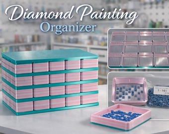 May include: A teal and pink diamond painting organizer with multiple small compartments. The organizer has a stackable design and includes trays and a bag of blue diamond painting gems. Text on the image reads "Diamond Painting Organizer."
