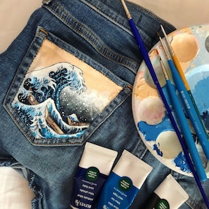 Jeans con dipinti sulle tasche store