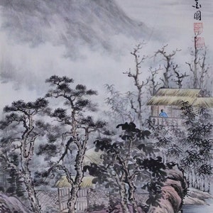 May include: A traditional Chinese ink and wash painting depicting a misty mountain landscape with a small house and trees. The painting is done in shades of gray and black with hints of red and yellow.