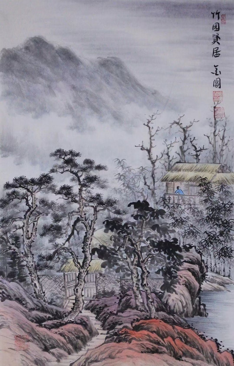 May include: A traditional Chinese ink and wash painting depicting a misty mountain landscape with a small house and trees. The painting is done in shades of gray and black with hints of red and yellow.