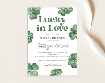 May include: A white bridal shower invitation with green shamrock illustrations. The invitation reads "Lucky in Love" and includes the bride-to-be's name, Katelyn Walsh, the date and time of the shower, and the location. RSVP information is also included.