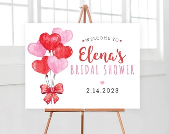 Könnte beinhalten: Ein weißes Schild für eine Brautparty mit einem Design aus roten und rosafarbenen Herzballons. Auf dem Schild steht "Willkommen zur Brautparty von Elena 2.14.2023".