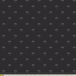 May include: Dark gray fabric with a repeating pattern of small, stylized white floral designs. The flowers have a central dot with radiating lines, creating a delicate, all-over print. The fabric is measured in inches.
