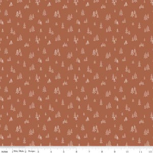 May include: A fabric with a repeating pattern of white fir trees on a rust-colored background. The trees vary in size and are evenly distributed across the fabric. The design is simple and evokes a forest theme.