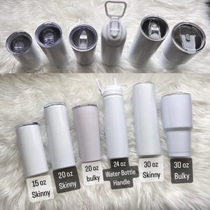 May include: An assortment of white insulated tumblers and water bottles in various sizes, including 15 oz, 20 oz, 24 oz, and 30 oz. Styles include skinny and bulky designs, with lids and handles visible. The products are displayed on a fluffy white surface.