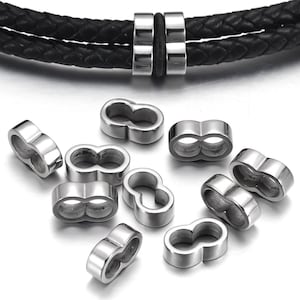 May include: Ten silver-toned metal beads with a double-loop design. The beads are designed to be used as spacers or charms on bracelets or necklaces.