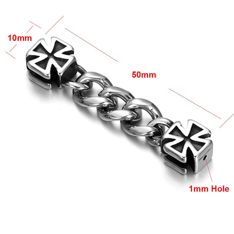 May include: A silver chain with two silver cross-shaped charms. The chain is 50mm long and the charms are 10mm wide. Each charm has a 1mm hole.