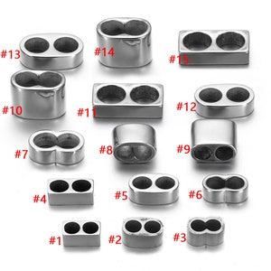 May include: Assortment of 15 silver-toned metal double-loop connectors in various shapes and sizes. The connectors are numbered 1 through 15.