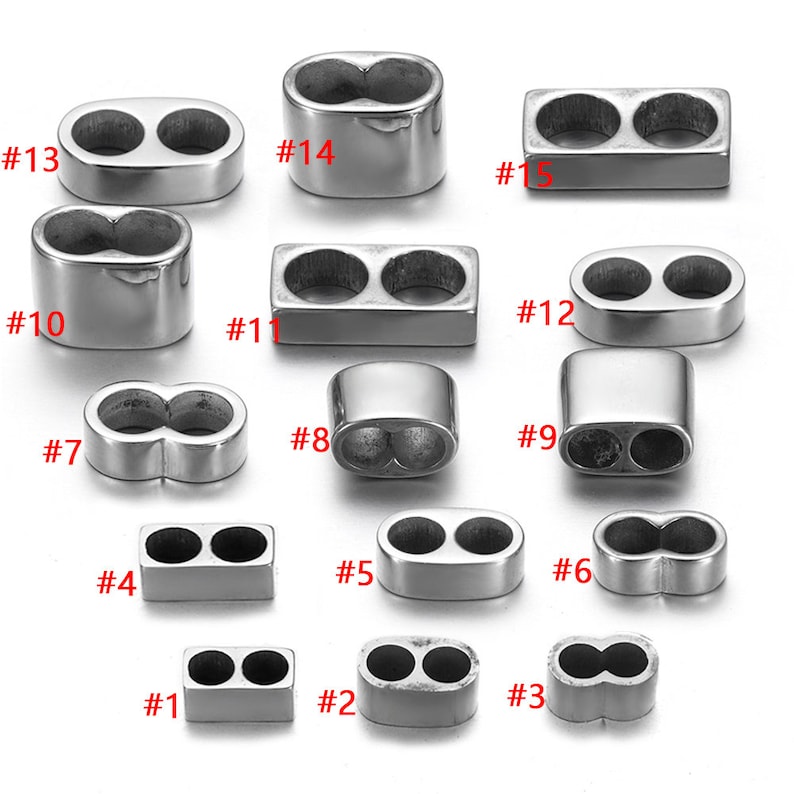 May include: Assortment of 15 silver-toned metal double-loop connectors in various shapes and sizes. The connectors are numbered 1 through 15.