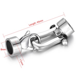 May include: Silver-toned metal clasp with a hook and loop closure. The clasp measures 45mm in length, 8mm in diameter, and 11mm in width.