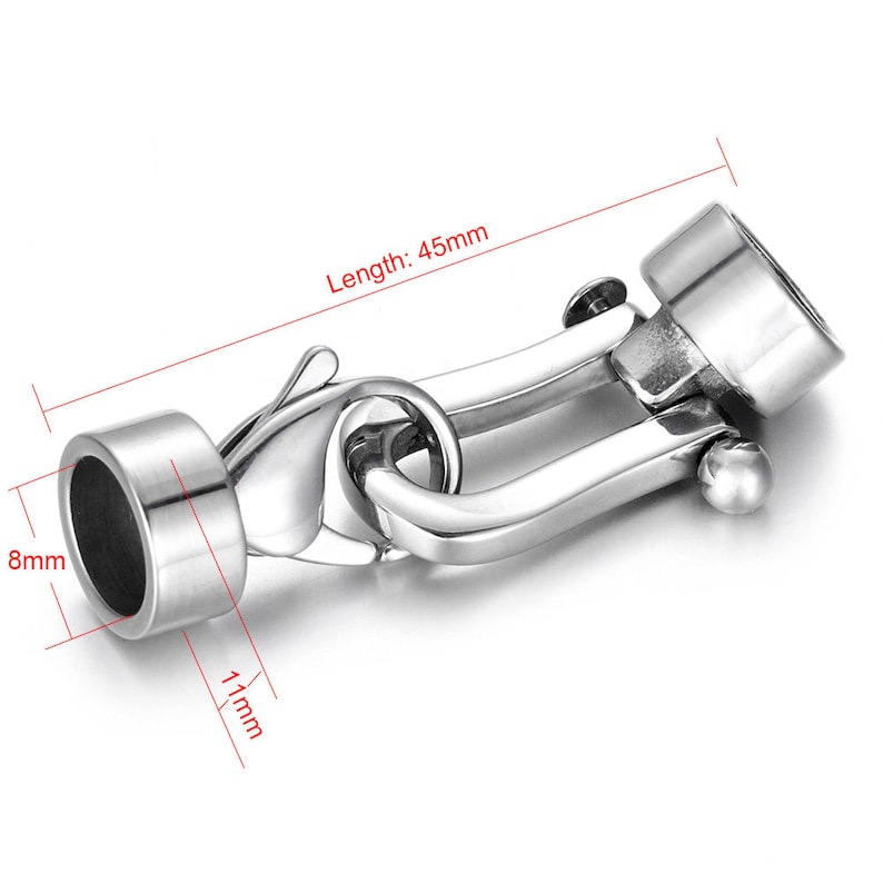 May include: Silver-toned metal clasp with a hook and loop closure. The clasp measures 45mm in length, 8mm in diameter, and 11mm in width.