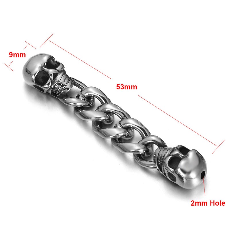 May include: Silver skull charm with a 53 mm long chain and a 2 mm hole. The skull is 9 mm wide.