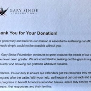 May include: A white letter with blue and red accents thanking someone for their donation to the Gary Sinise Foundation. The letter explains that the foundation helps veterans, first responders, and their families.