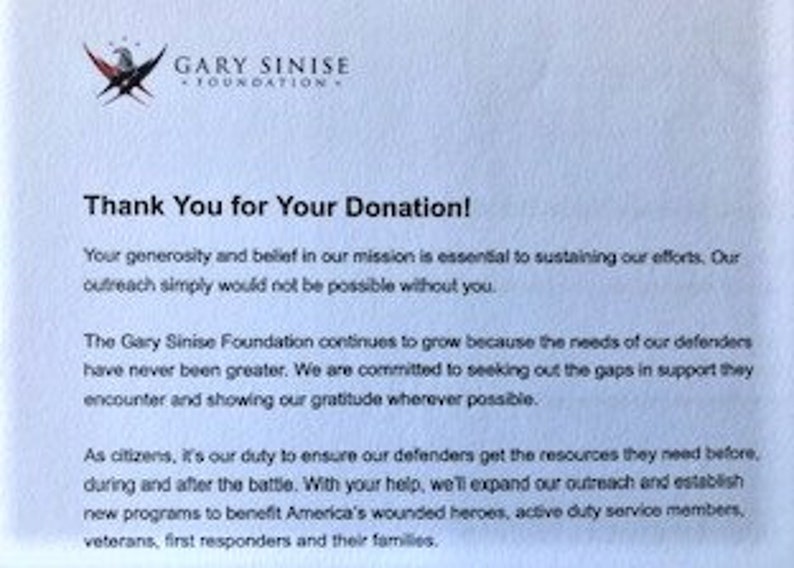 May include: A white letter with blue and red accents thanking someone for their donation to the Gary Sinise Foundation. The letter explains that the foundation helps veterans, first responders, and their families.