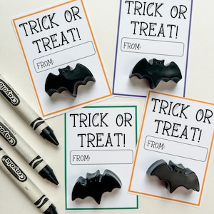 Black bat crayon Halloween party favors.
