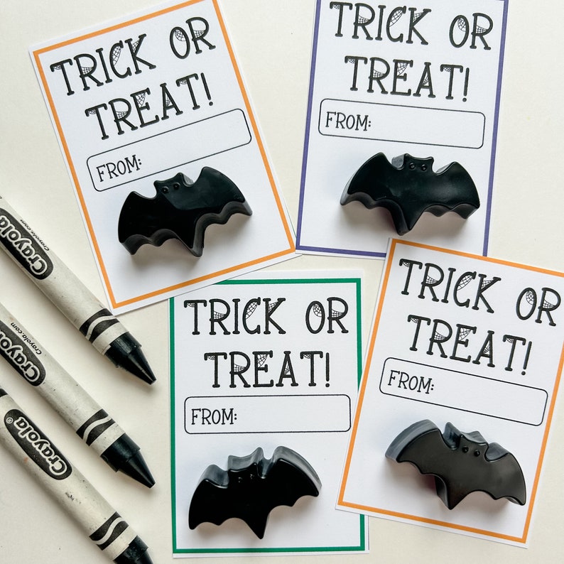 Black bat crayon Halloween party favors.