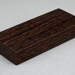 May include: A set of three ceramic mugs with a speckled, matte finish. Each mug features a different color: light blue, cream, and gray. The mugs have a simple, modern design and a comfortable handle.