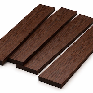 May include: Four rectangular, dark brown wooden planks are arranged diagonally against a white background. The planks have a visible wood grain texture, suggesting a natural material. The color is a rich, warm brown.