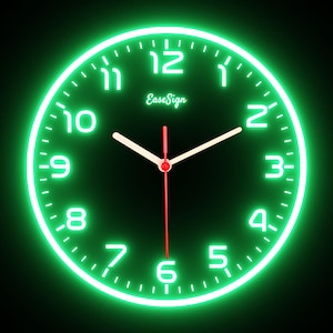 May include: A round, neon green clock with white numerals and hands against a dark green background. The clock face displays the text "EaseSign". The second hand is red.