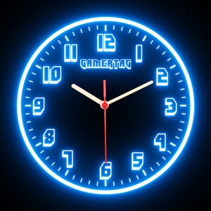 May include: A black clock face with white numbers and a blue neon outline. The clock face reads "GAMERTAG" and shows the time as 12:00.
