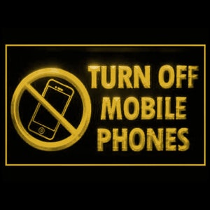 May include: A yellow neon sign with a black background that says "TURN OFF MOBILE PHONES". The sign also has a yellow circle with a diagonal line through it and a yellow silhouette of a mobile phone inside the circle.