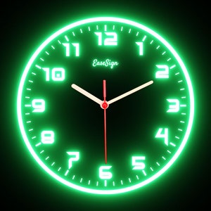 May include: A round, neon green clock with white numerals and hands against a black background. The clock face displays the text "EaseSign" in a cursive font. The hands indicate the time is approximately 1:00.