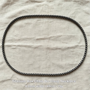 May include: A dark gray titanium box chain necklace, no clasp design. The necklace is 4.0mm wide, 60cm long, and weighs 19g. The text at the bottom reads "Titanium Box Chain No-Clasp Necklace" and the measurements.