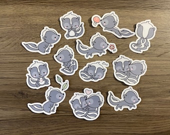 May include: A set of 12 cute cartoon skunk stickers. The stickers feature skunks in various poses, including sleeping, holding a flower, and walking. The stickers are perfect for adding a touch of whimsy to your planner, laptop, or water bottle.