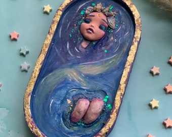 Sleepy Mermaid OOAK Trinket mix media using White Cement, Acrylic, Resin, Goldleaf Glitter, & Seashells.