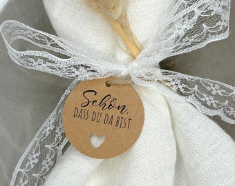 Round gift tag - Glad you're here - made of kraft paper with a heart