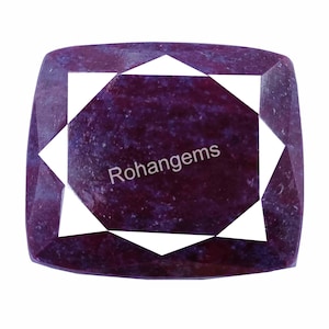 May include: A purple gemstone with a star-shaped cut. The gemstone is faceted and has a polished finish. The gemstone is set in a square shape.