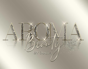 May include: A gold and silver logo with the text "Aroma Beauty by Julia". The logo has a glittery effect.