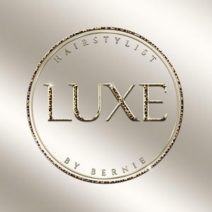 May include: A gold and leopard print logo for a hairstylist. The word "LUXE" is in large, bold letters with a leopard print pattern. The words "HAIRSTYLIST" and "BY BERNIE" are in smaller text, encircling the main text.