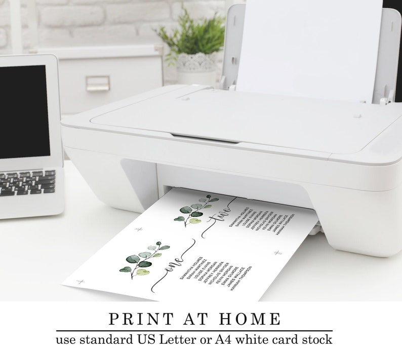 May include: A white printer with a sheet of paper emerging from it. The paper is divided into two sections with the words "one" and "two" written on them. The paper also features a floral design with green leaves. The text "PRINT AT HOME use standard US Letter or A4 white card stock" is at the bottom of the image.