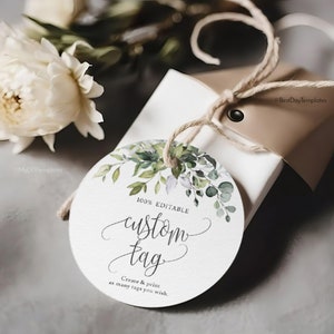 Może przedstawiać: Okrągła, biała etykieta prezentowa z akwarelowym wzorem zielonych liści i gałęzi. Etykieta zawiera tekst "100% EDITABLE custom tag Create & print as many tags you wish."