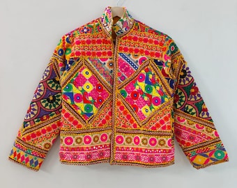 May include: A vibrant, embroidered jacket with a high collar. The jacket features a patchwork design with geometric patterns in red, yellow, pink, green, and blue. The sleeves and collar are also intricately embroidered with colorful details.