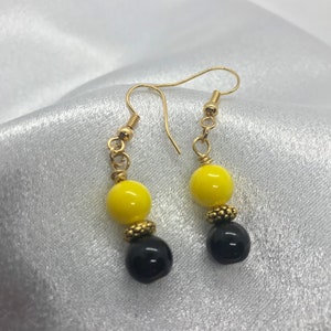 Black and Yellow Beaded Dangles on Gold Hooks.