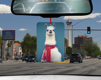 May include: A white llama with a red scarf around its neck. The llama is looking at the camera. The image is on a blue background.
