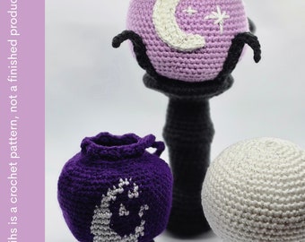 May include: Crocheted items including a purple sphere with a crescent moon design, a purple vase with a moon design, and a white sphere. The items are on black bases. The word "PATTERN" is in the image.