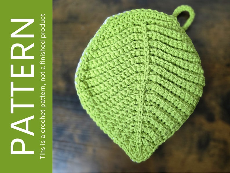 May include: A green crocheted leaf-shaped pot holder with a loop for hanging.