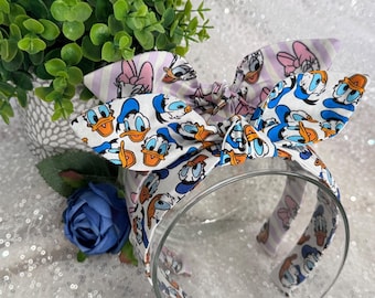 Grumpy and Sassy Duck hand-knotted bow headbands. Retro top knot. Women's hair accessories. Theme Park headbands.