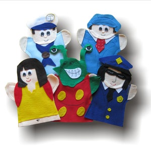 May include: Five felt hand puppets, including a sailor, a police officer, a woman, an alien, and a businessman. The puppets are all smiling and have different colored clothing.