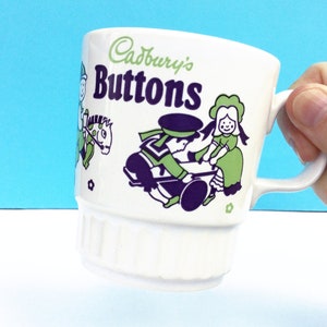 Vintage childs mug, Cadburys Buttons, cute nursery rhyme illustrations in green and purple, small white ceramic cup