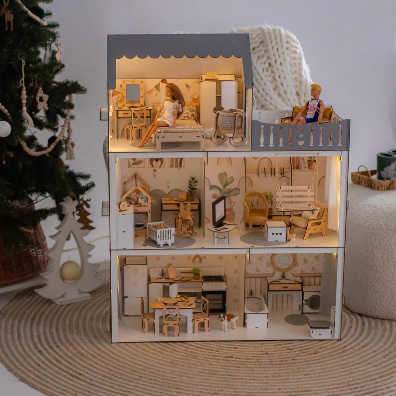 a beautifully decorated Christmas tree with ornaments and lights, and a dollhouse with a miniature interior, creating a cozy and festive atmosphere.