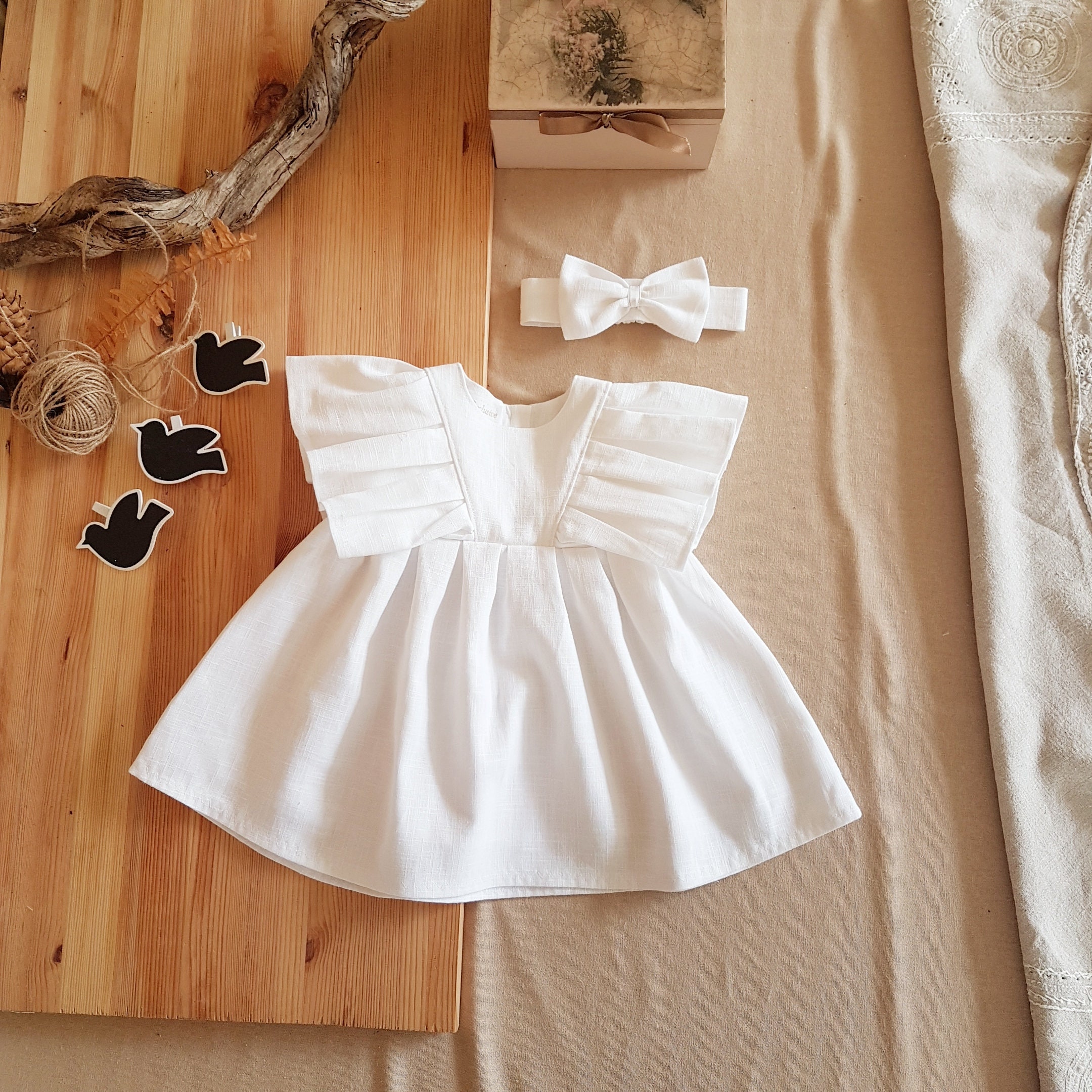 white linen baby dress