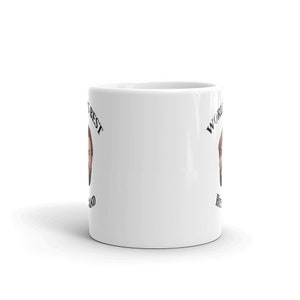 May include: White ceramic mug with black text that reads "World's Best Husband" on the right side and "World's Best Husband" on the left side. A man's face is pictured on each side of the mug.