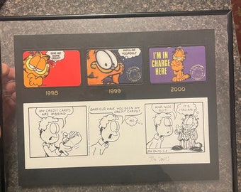 Rare Signed by Jim Davis GARFIELD cartoon strip and credit cards. Rare known limited PAWS collectible.