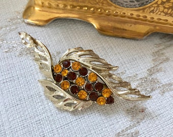 Mid-century 1950's gold tone TOPAZ rhinestones - Stylized leaf shape brooch. Over 3.35" long