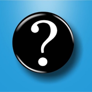 May include: A black button with a white question mark on it.